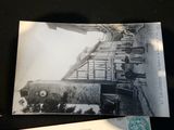 a black and white photo of a train on the tracks