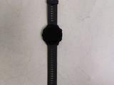 a watch that is laying on a white surface