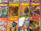 the covers of the comics are lined up on the table