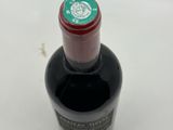 a bottle of wine that is sitting on a table