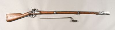 un vieux fusil au canon en bois, représenté sur un fond blanc