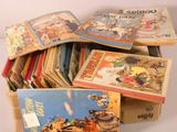 many children ' s books in a box on the table