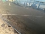 a reflection of a car on the side of the road
