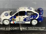 a model of a ford escort wrc car in a display case