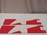 a picture of a pair of red and white scissors on a white surface