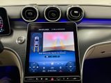 the interior of a car with a touch screen and steering controls