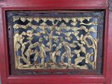 a picture of a wooden panel with a gold design on it