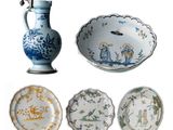 four different types of plates and a vase on the table