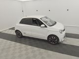 a picture of a small white car parked in a garage