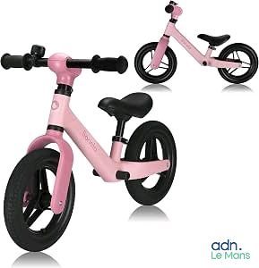 a pink bike that is sitting next to each other