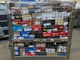a metal cart with many items on it in a warehouse