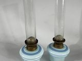 pair of blue and white glass candlesticks with gold accents