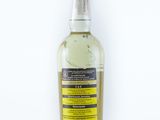a close up of a bottle of alcohol on a white surface