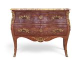 an antique chest of drawers with a marble top