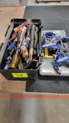 many different tools in a case on the floor