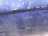 a close up of a blue bag with a handle