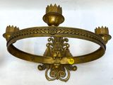 pair of antique brass wall sconces with a lion head on each of them