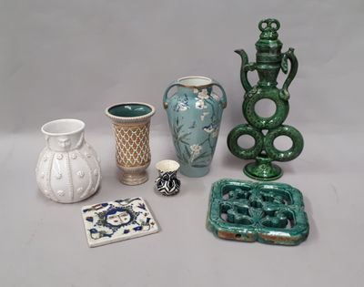 many different vases that are sitting on a table