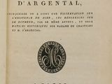 an old book with a black and white image of a coin