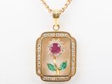 a close up of a necklace with a flower on it