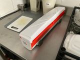 a white and red food warmer sitting on a kitchen counter