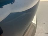 a close up of a car ' s front bumper
