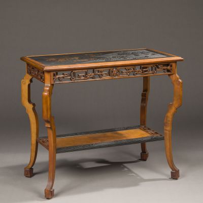 an antique table with a marble top and wooden legs
