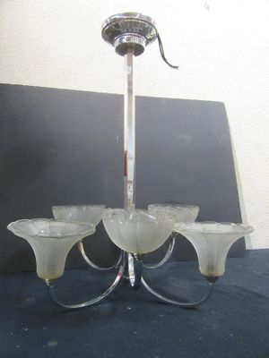 a chandelier with five glass shades hanging from it