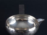 an antique silver teapot on a black background with a black background
