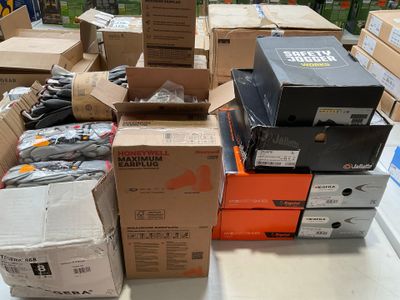 many boxes of electronic equipment sitting on a table