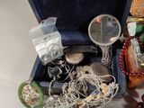 a box with a bunch of jewelry inside of it