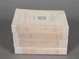 three books stacked on top of each other on a table