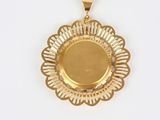 an image of a gold plated pendant on a white background