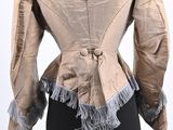 the back of a beige jacket on a mannequin mannequin mannequin mannequin mannequin mannequin mannequin mannequin