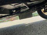 a close up view of a car ' s exhaust pipe