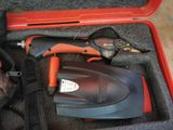 a tool in a case that is sitting on the floor