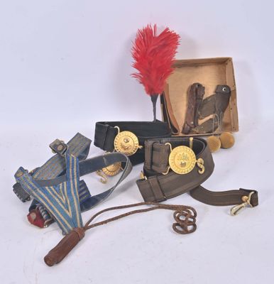 a box with some items on it and a red feather