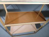 a glass shelf with two shelves on top of it
