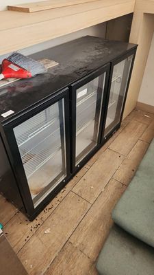 an image of a kitchen with a refrigerator and a counter