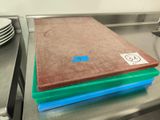 a stack of plates on a table with a brown and green cover