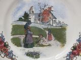 a plate with a picture of a woman and a child on it