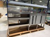 a metal shelf that has a bunch of drawers on it