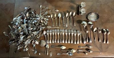 many silver spoons and spoon spoons on a table