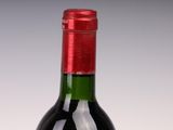 a bottle of wine that is sitting on a table