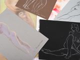 many drawings of a woman sitting on a table