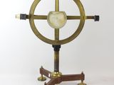 an image of a clock on a stand on a white background