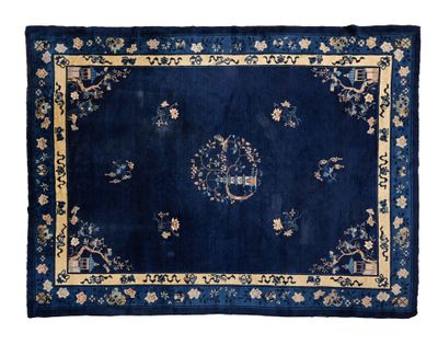 a blue rug with a floral design on it