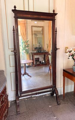 a large mirror sitting on a table in a room