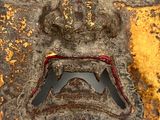 a close up of a mask on a white surface