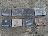 many plaques on the sidewalk that have been placed on the ground
